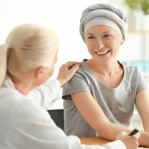 Woman after chemotherapy visiting doctor in hospital